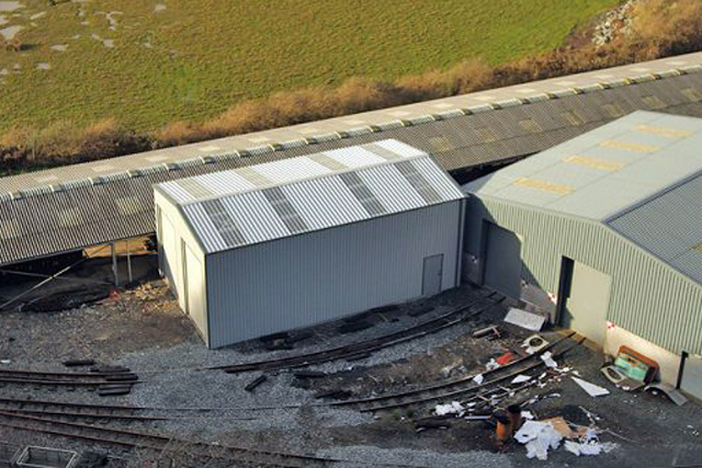 Aerial shot of completed building in train yard