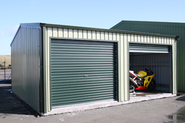 A building housing a yellow and white motorbike